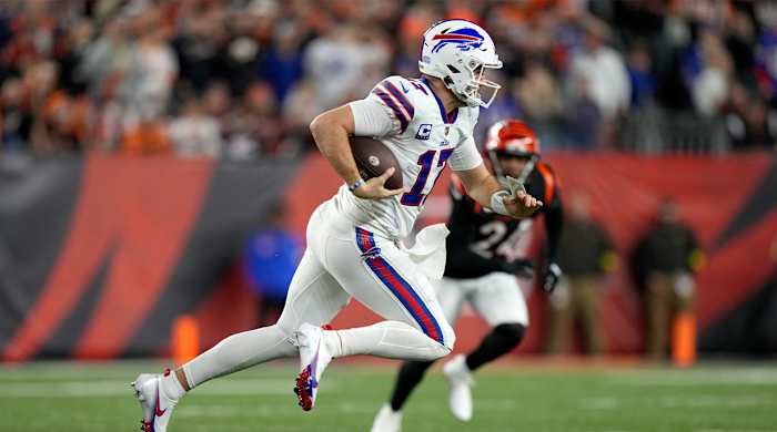 Buffalo Bills quarterback Josh Allen (17) carries the ball in the first quarter of a Week 17 NFL game against the Cincinnati Bengals, Monday, Jan. 2, 2023, at Paycor Stadium in Cincinnati.